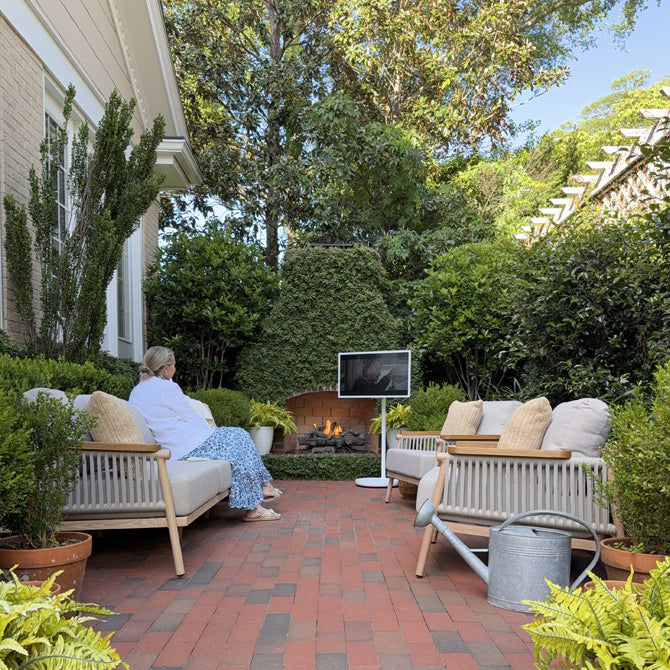 Use a portable TV on wheels to watch a movie in the backyard.