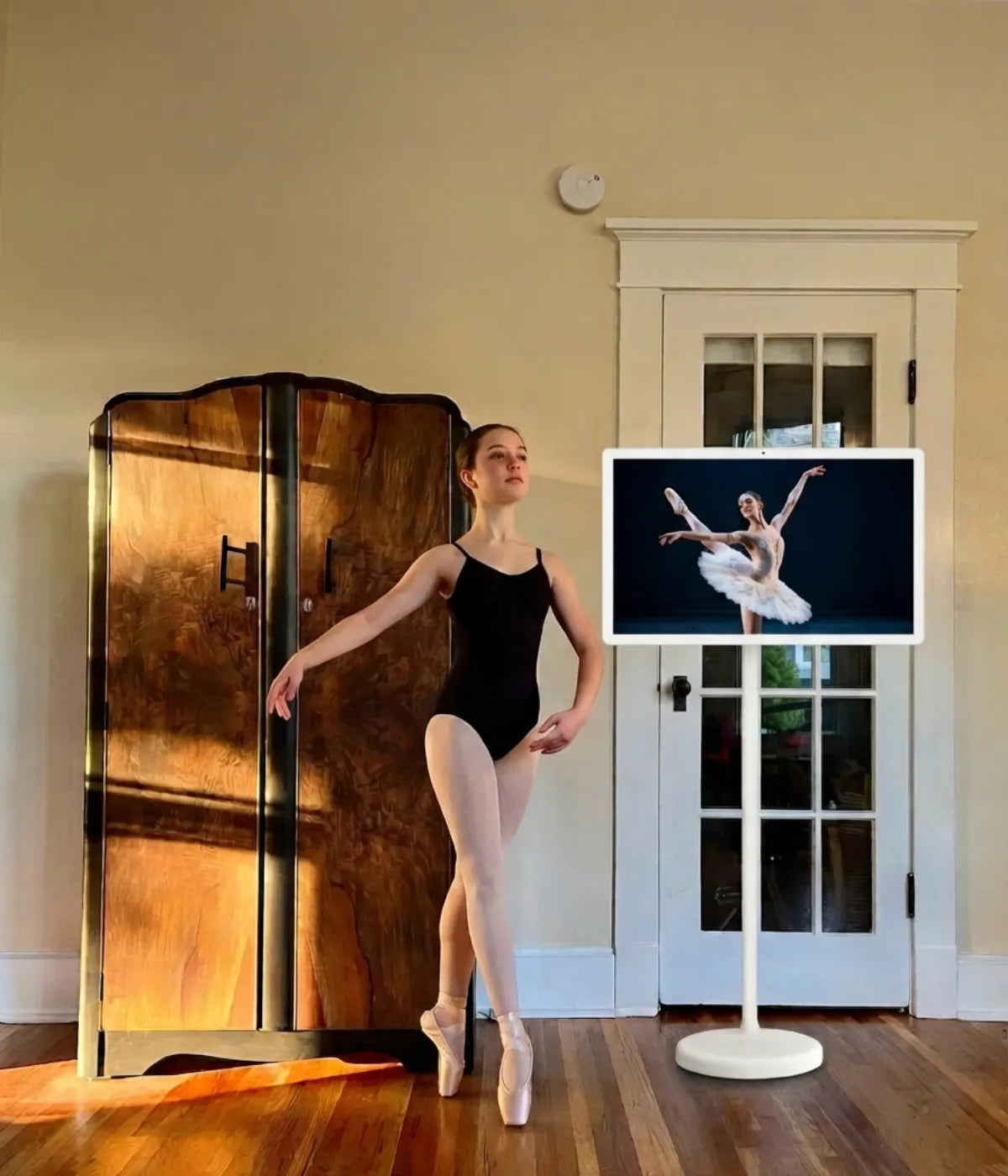 dancing ballet with a portable smart screen on wheels