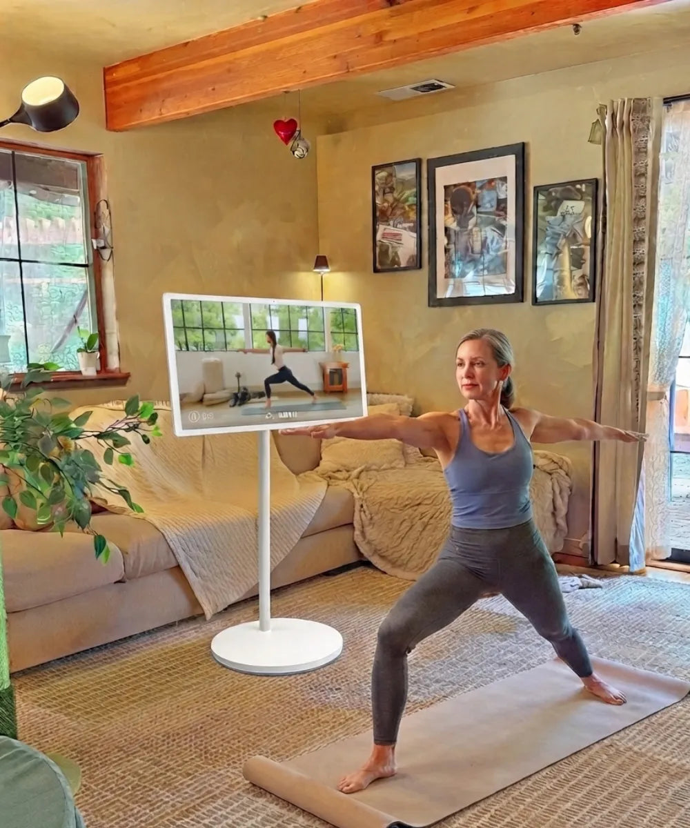 morning yoga with a portable TV on wheels