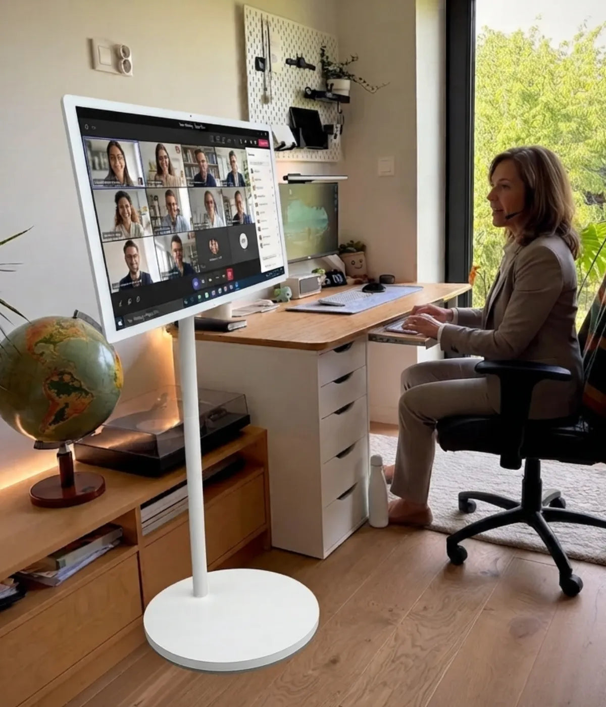 video meeting with a portable TV on wheels